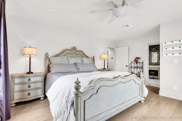 bedroom featuring light wood-type flooring, ceiling fan, visible vents, and baseboards