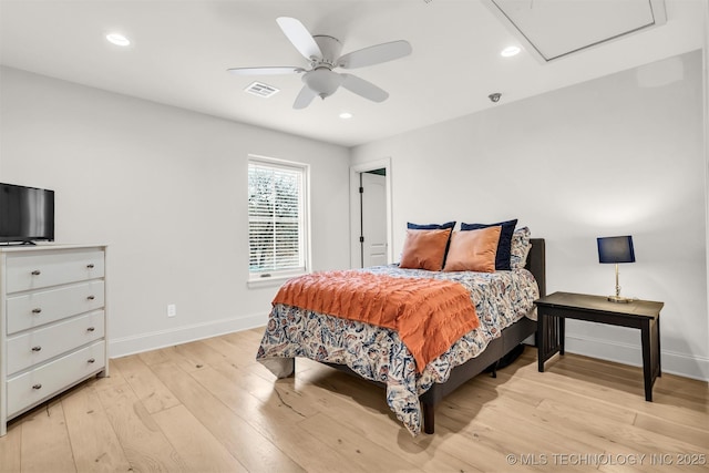 bedroom featuring baseboards, light wood-type flooring, visible vents, and recessed lighting