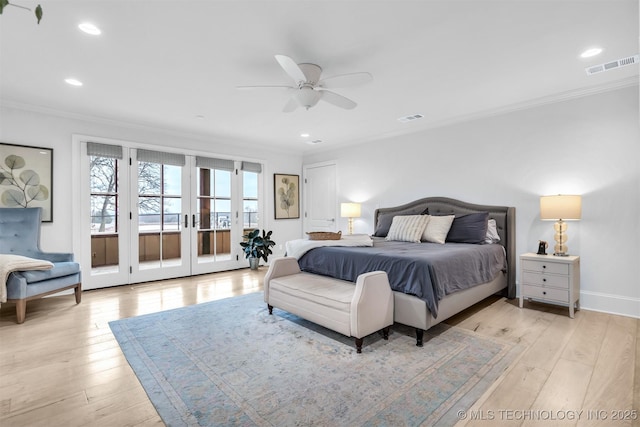 bedroom featuring ornamental molding, french doors, visible vents, and light wood finished floors