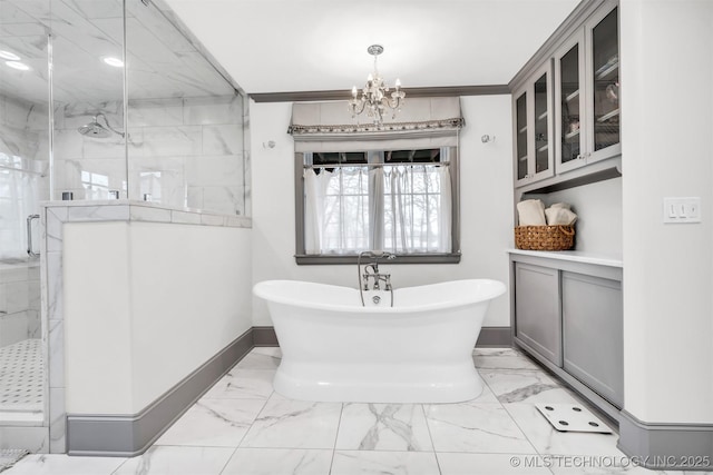 full bathroom with marble finish floor, a shower stall, baseboards, and a soaking tub