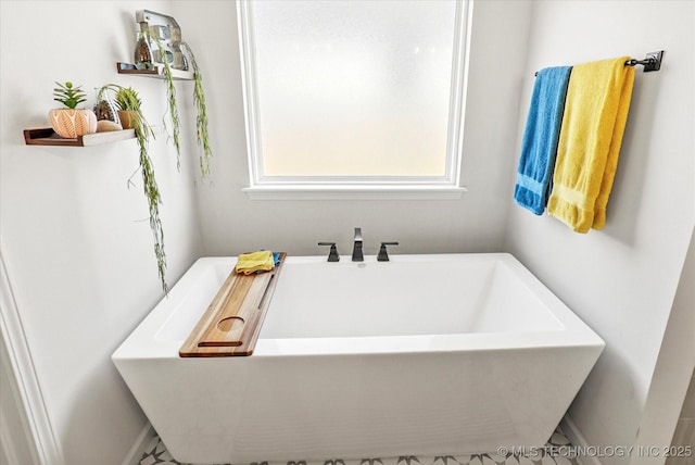 bathroom with a freestanding bath