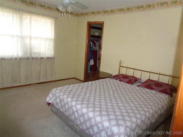 carpeted bedroom with baseboards