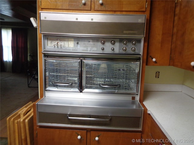 kitchen featuring brown cabinets