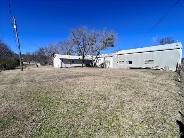 view of yard with cooling unit, an outdoor structure, and an outbuilding