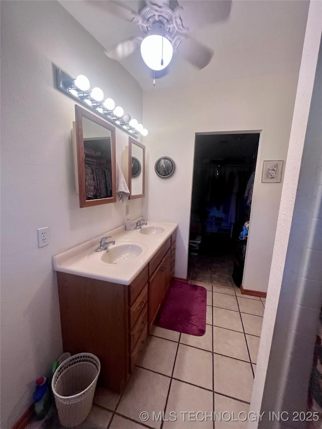 full bathroom featuring a ceiling fan, tile patterned flooring, a sink, and double vanity