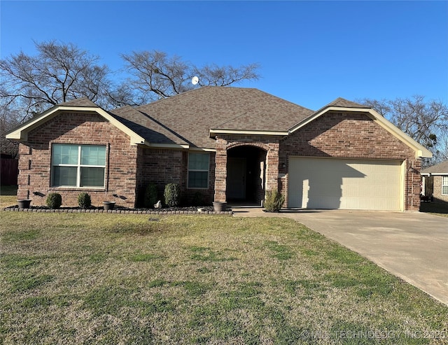 ranch-style house with brick siding, driveway, a front yard, and a garage