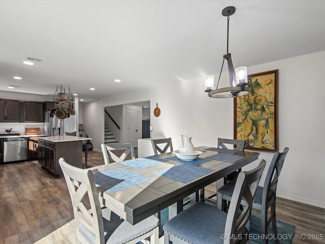 dining room with baseboards, visible vents, stairway, dark wood-style flooring, and recessed lighting