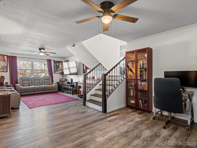 office with ceiling fan, ornamental molding, and wood finished floors