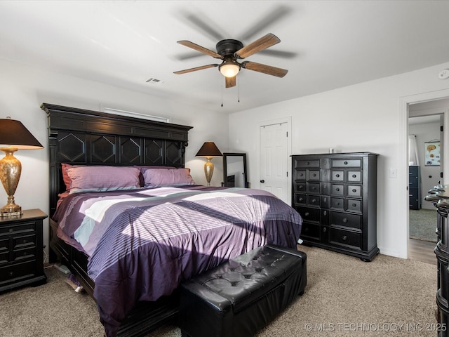 bedroom with a ceiling fan, carpet, and visible vents