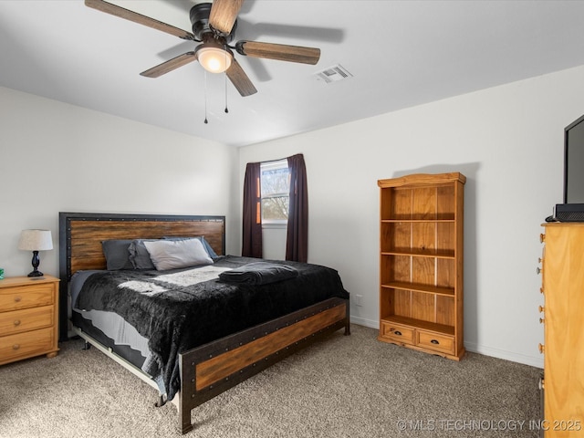 carpeted bedroom featuring visible vents, ceiling fan, and baseboards