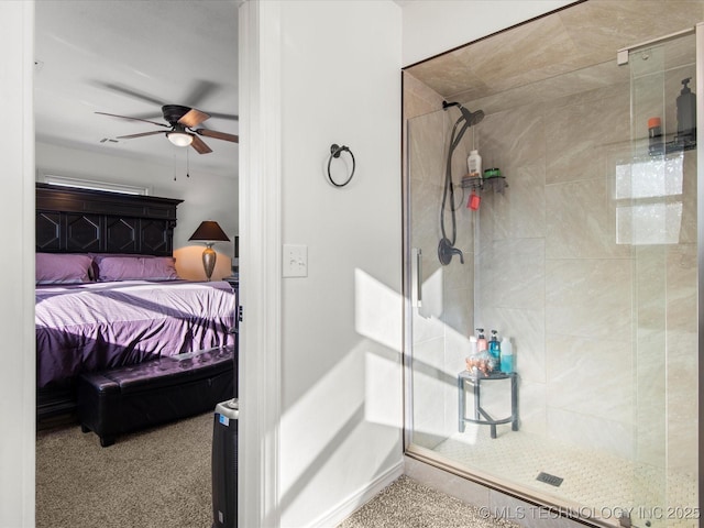 bathroom with a ceiling fan, connected bathroom, a shower stall, and baseboards