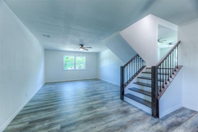 bonus room with stairway, wood finished floors, visible vents, and ceiling fan