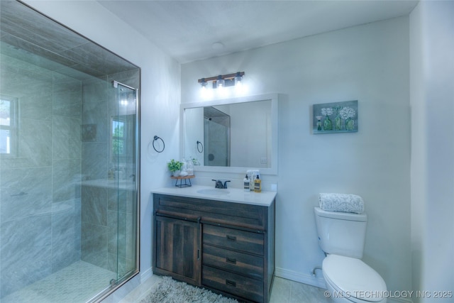 full bath with a shower stall, toilet, vanity, and baseboards