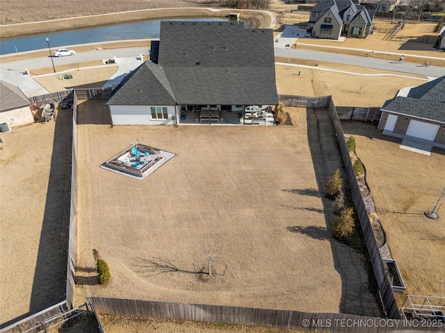 bird's eye view with a water view