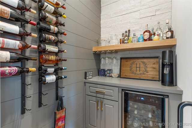 interior space featuring a dry bar and beverage cooler