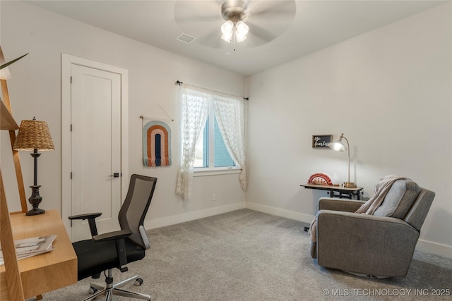 carpeted office space featuring a ceiling fan, visible vents, and baseboards