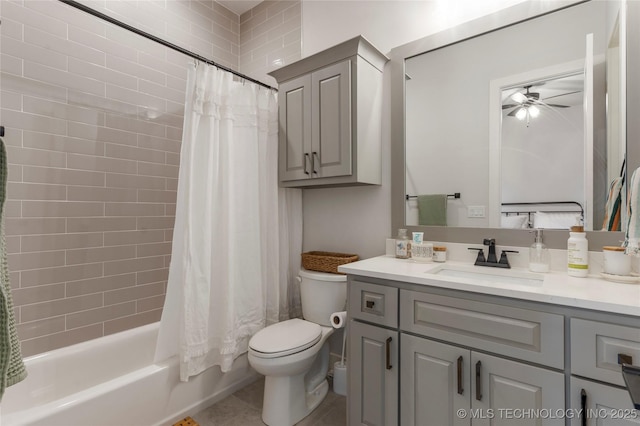 bathroom with tile patterned flooring, toilet, vanity, a ceiling fan, and shower / bath combination with curtain