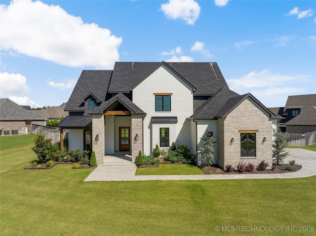 2715 E 136th St S, Bixby, OK 74008 - view of front of home with a standing seam roof, stone siding, a shingled roof, and a metal roof