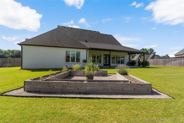 2715 E 136th St S, Bixby, OK 74008 - back of house with a vegetable garden and roof with shingles