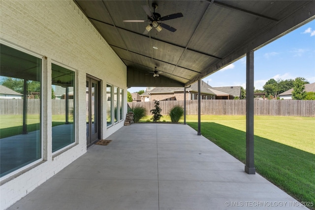 2715 E 136th St S, Bixby, OK 74008 - fenced backyard with ceiling fan and a patio