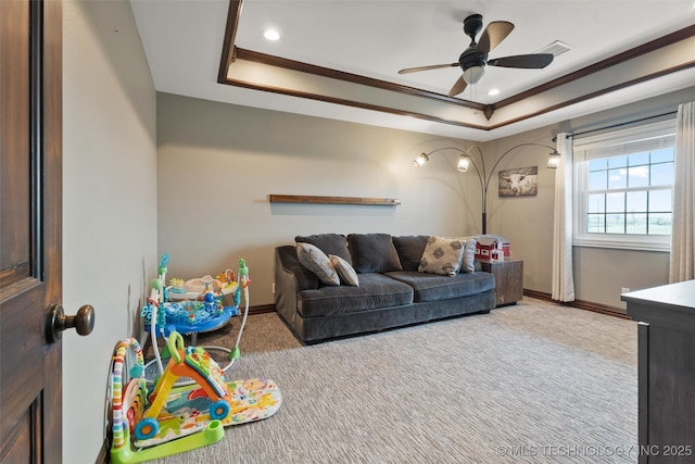 game room featuring baseboards, ornamental molding, a raised ceiling, and carpet flooring