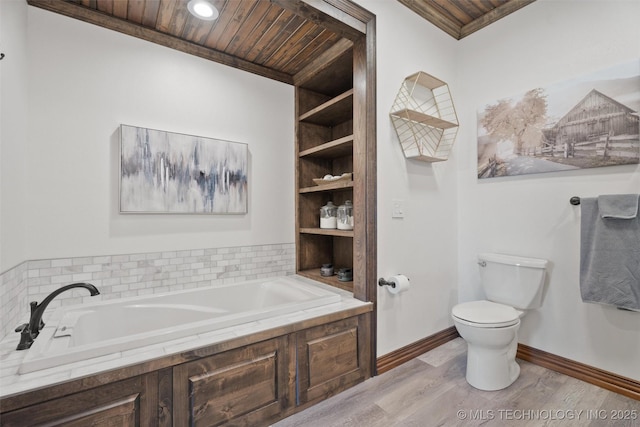 bathroom featuring wooden ceiling, a garden tub, toilet, wood finished floors, and baseboards