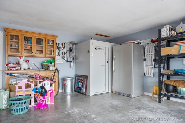 garage with freestanding refrigerator
