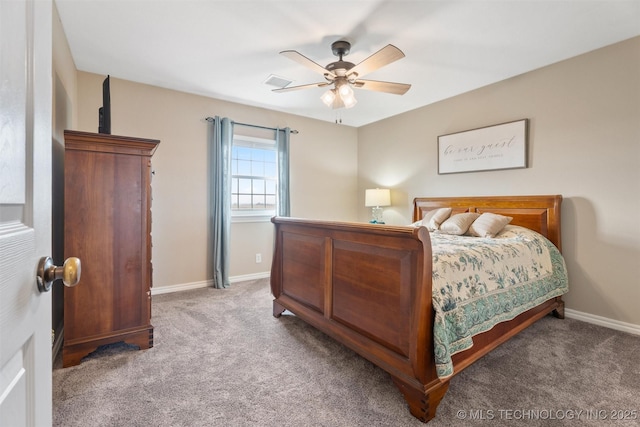 bedroom with ceiling fan, carpet, and baseboards