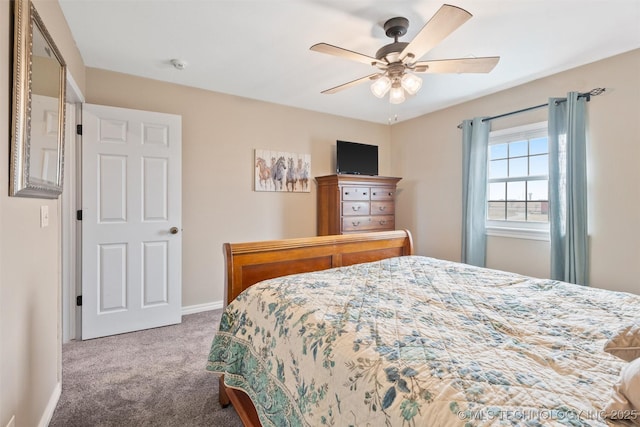 bedroom featuring ceiling fan, carpet floors, and baseboards