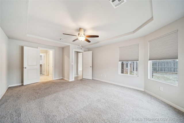 unfurnished bedroom with light colored carpet, visible vents, and baseboards