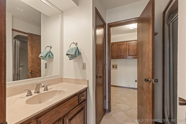 bathroom with vanity and tile patterned floors