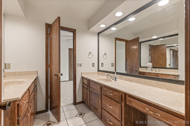 bathroom featuring recessed lighting, tile patterned flooring, and vanity