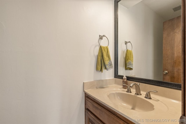 bathroom with visible vents and vanity