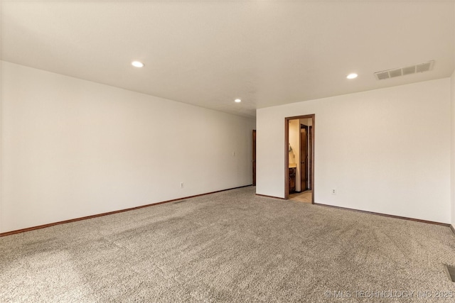 empty room with light carpet, baseboards, visible vents, and recessed lighting