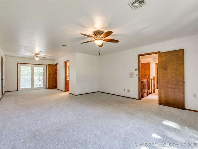 8934 S 41st W Ave, Tulsa, OK 74132 - spare room featuring ceiling fan and light carpet