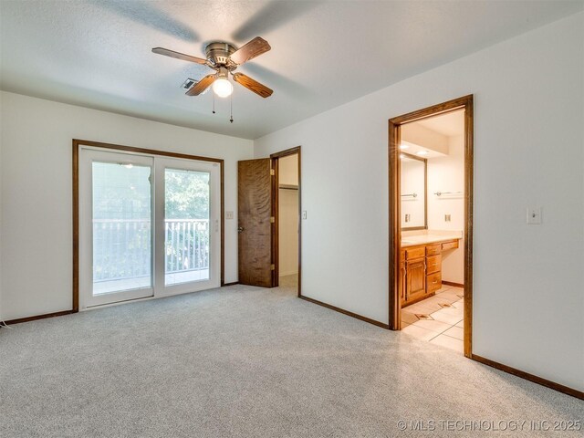 8934 S 41st W Ave, Tulsa, OK 74132 - unfurnished bedroom featuring light colored carpet, access to outside, ensuite bath, and a ceiling fan