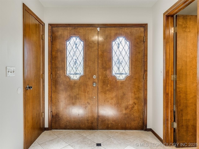 8934 S 41st W Ave, Tulsa, OK 74132 - entryway with light tile patterned floors and baseboards