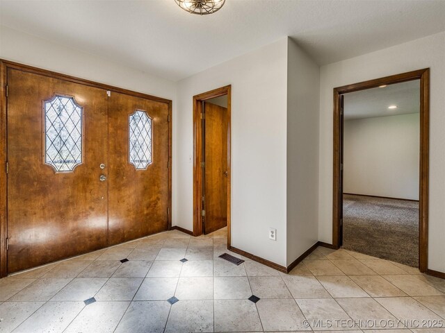 8934 S 41st W Ave, Tulsa, OK 74132 - entryway featuring baseboards and light tile patterned flooring