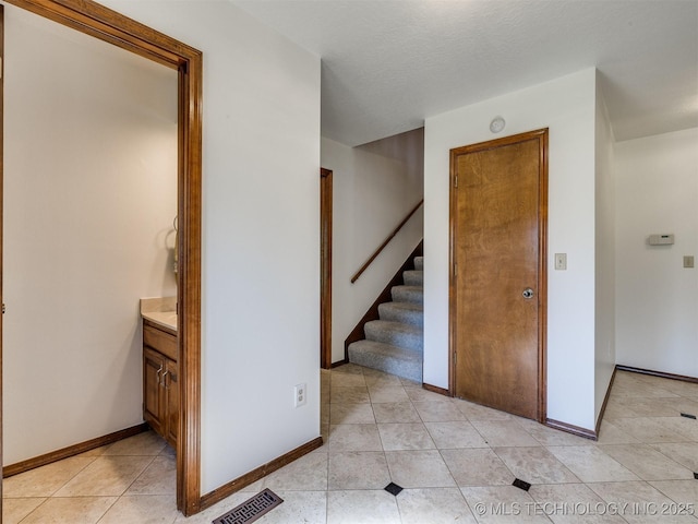 8934 S 41st W Ave, Tulsa, OK 74132 - stairway featuring tile patterned flooring