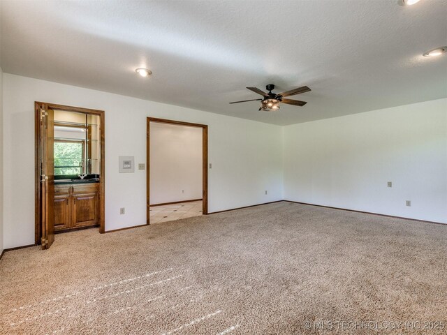 8934 S 41st W Ave, Tulsa, OK 74132 - spare room featuring light carpet and a ceiling fan