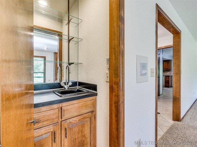8934 S 41st W Ave, Tulsa, OK 74132 - indoor wet bar with light tile patterned floors