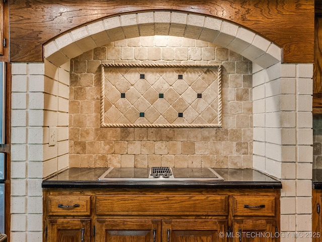 8934 S 41st W Ave, Tulsa, OK 74132 - kitchen featuring black electric stovetop, dark countertops, and brown cabinetry
