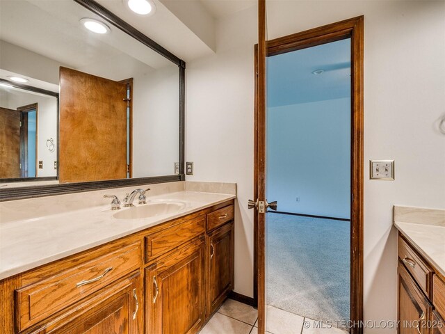 8934 S 41st W Ave, Tulsa, OK 74132 - bathroom featuring vanity, tile patterned floors, and recessed lighting