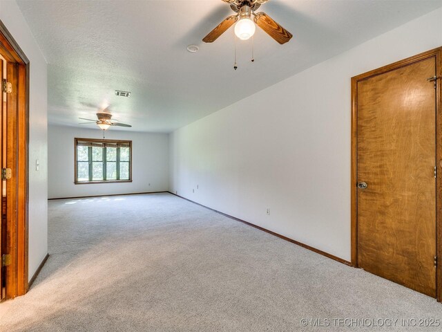 8934 S 41st W Ave, Tulsa, OK 74132 - spare room featuring ceiling fan and carpet flooring
