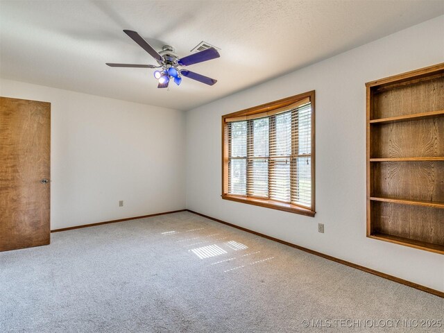 8934 S 41st W Ave, Tulsa, OK 74132 - empty room with carpet floors and a ceiling fan
