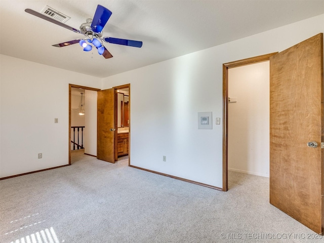 8934 S 41st W Ave, Tulsa, OK 74132 - unfurnished bedroom with light colored carpet, ceiling fan, and connected bathroom