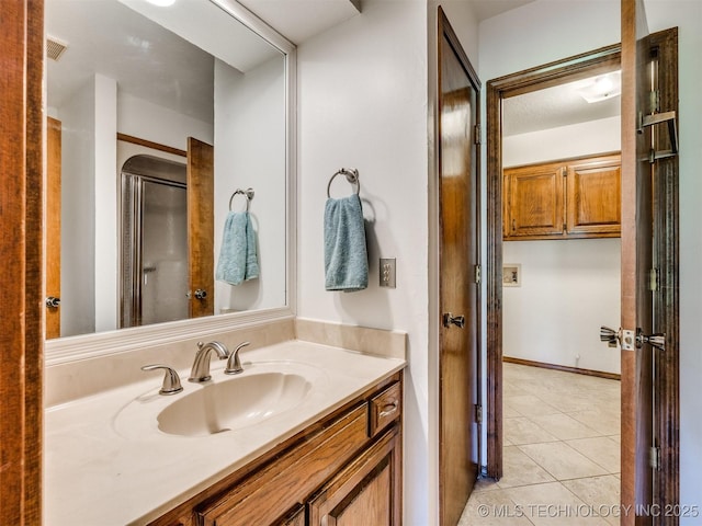 8934 S 41st W Ave, Tulsa, OK 74132 - bathroom with vanity and tile patterned floors