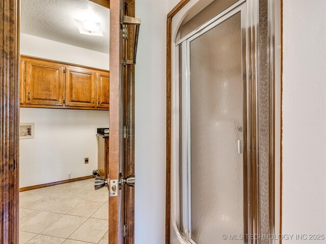 8934 S 41st W Ave, Tulsa, OK 74132 - bathroom with a stall shower and tile patterned floors