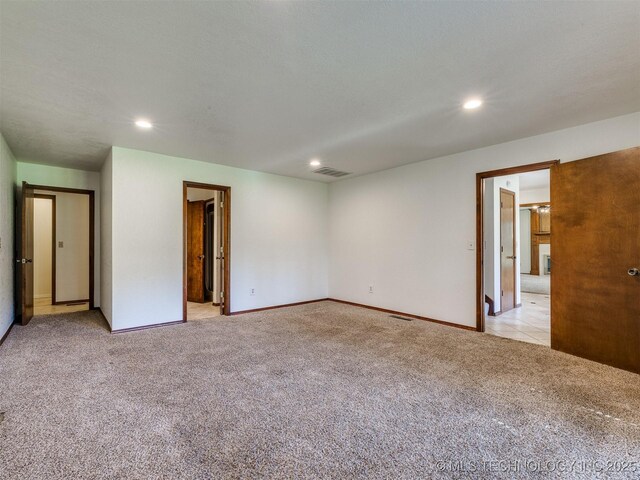8934 S 41st W Ave, Tulsa, OK 74132 - unfurnished bedroom with light carpet and recessed lighting