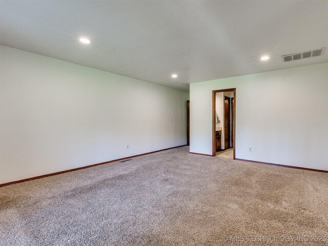 8934 S 41st W Ave, Tulsa, OK 74132 - unfurnished room featuring light carpet and recessed lighting